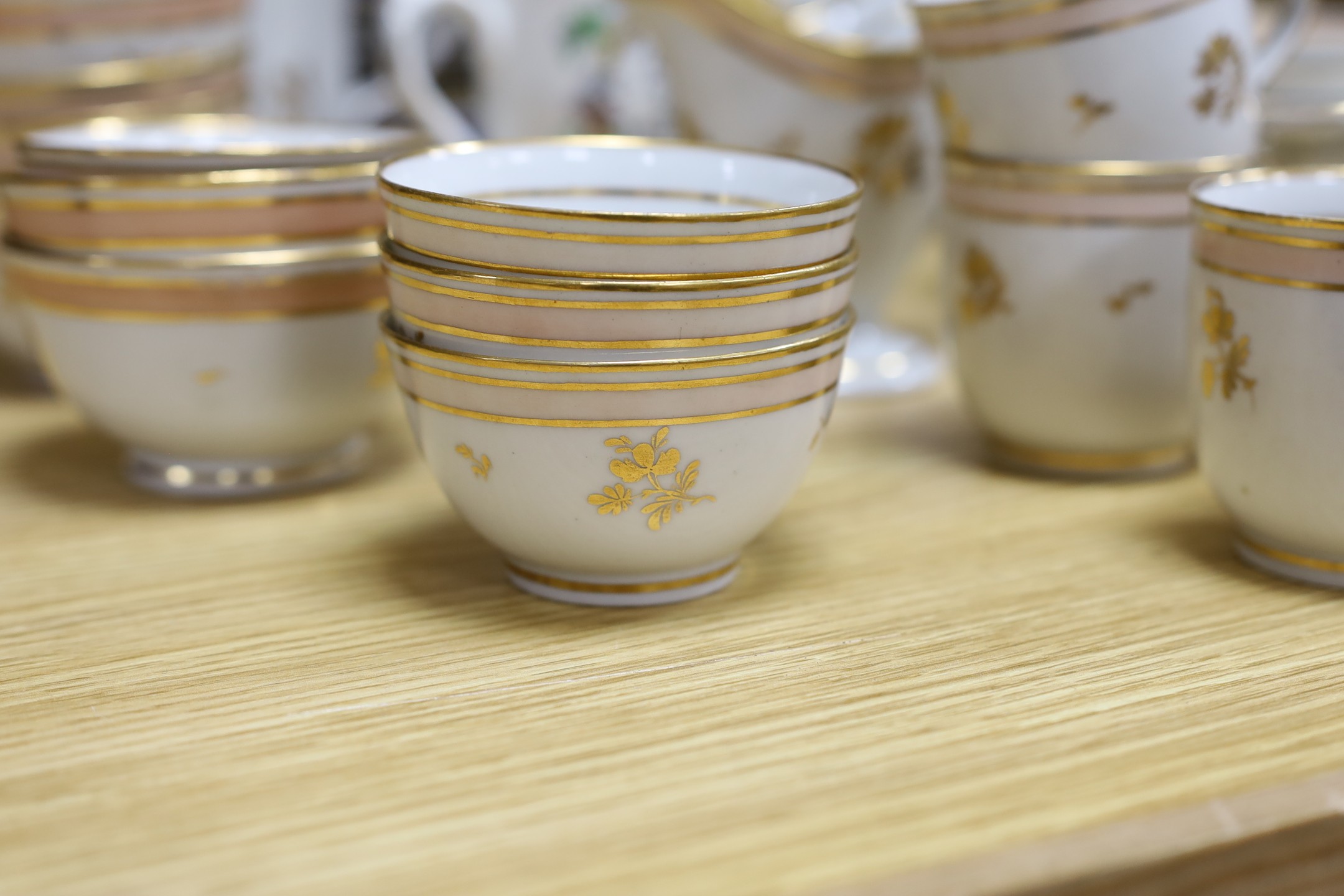 A 19th century Harvest jug and mug, a Victorian gilt tea set and mixed plates and a platter, jug 19 cms high.